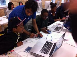 Kids learning how to control motors using Arduino.